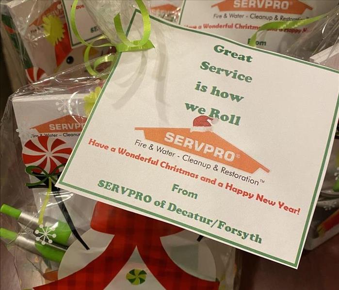 Clear Christmas bags with candy, and SERVPRO swag inside of them.