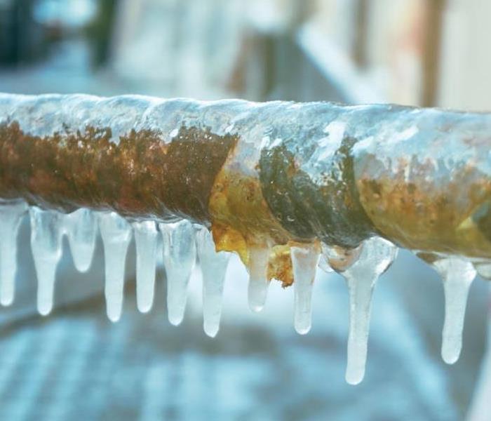 Copper pipe with Frozen water on it.