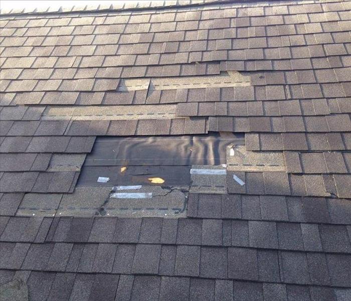 a roof that is missing shingles.